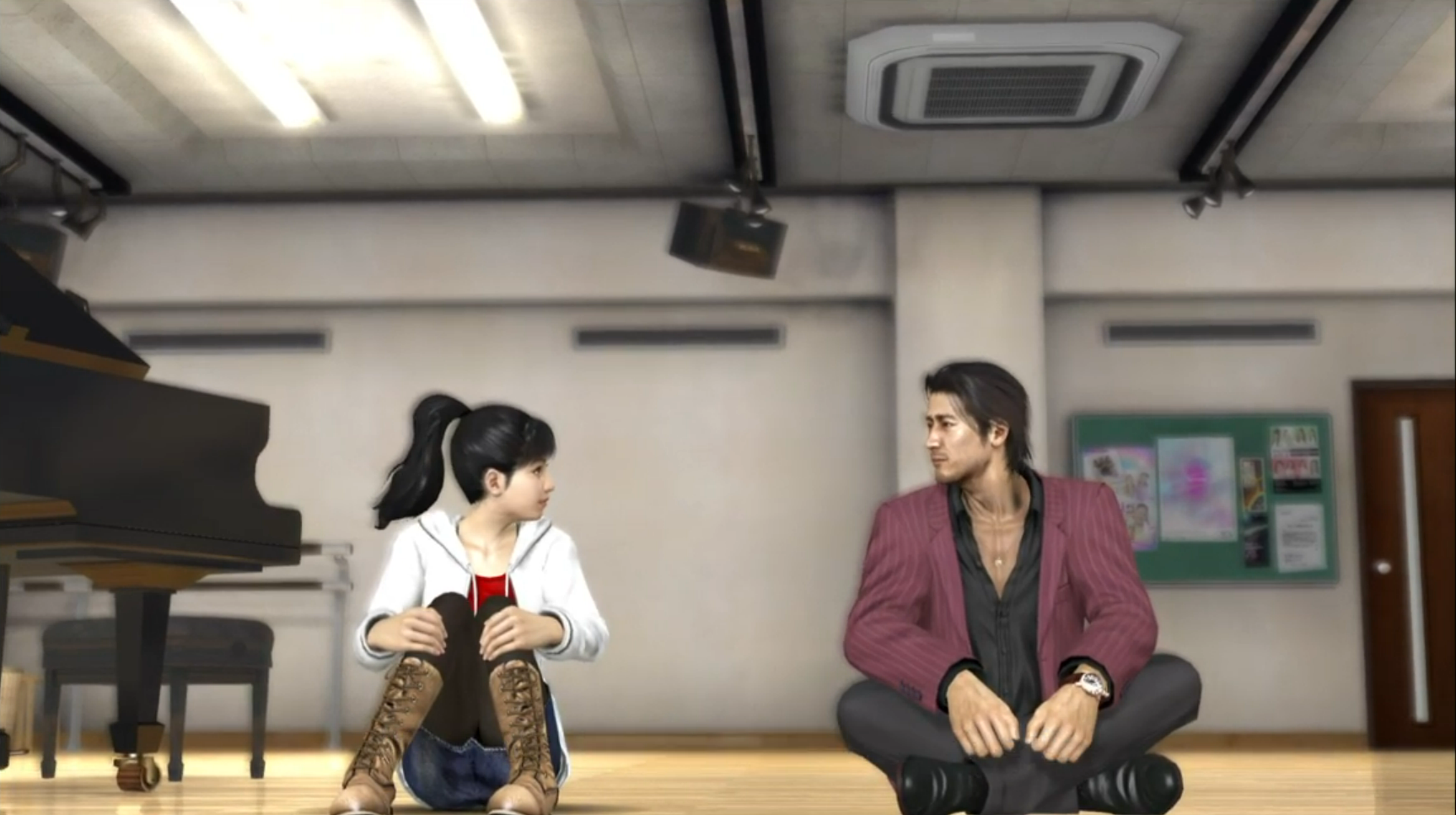Akiyama Shun and Sawamura Haruka sit on the floor of a dance studio together, looking at one another.